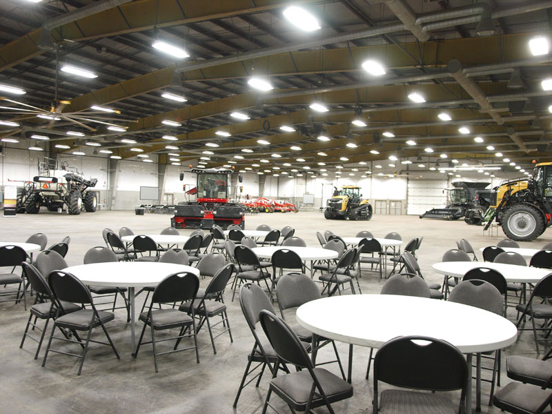 Event Centre tables with large farm equipment on display